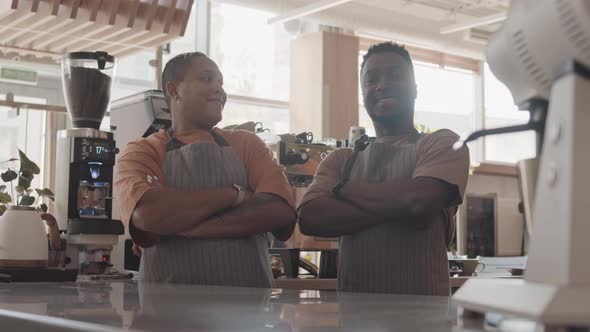 Supervisor and Waiter Posing in Cafe