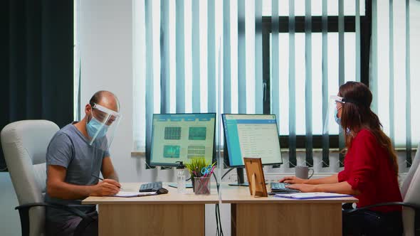 People with Mask and Visor Working