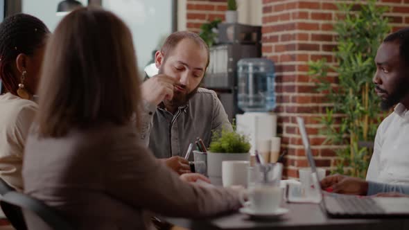 Close Up of Business Man Discussing Strategy Plan with People