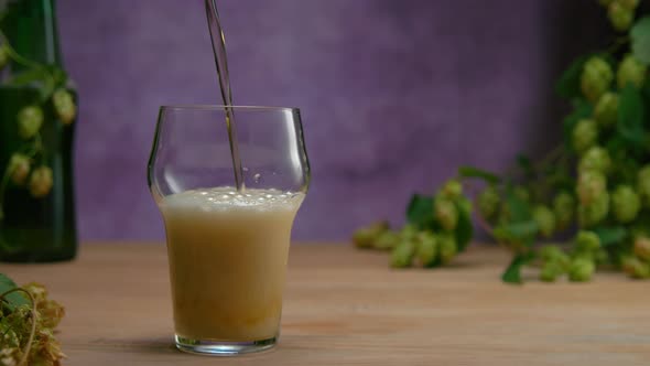 Pouring Lager Beer Into Pinta Glass