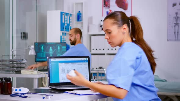 Medical Woman Physician Checking Treatment of Diagnosed Patients