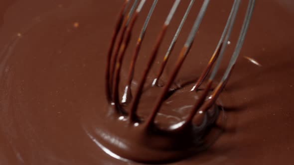 Chocolatier Make Organic Bitter Handcrafted Dessert with Nuts Mixing Stirring Melted Chocolate