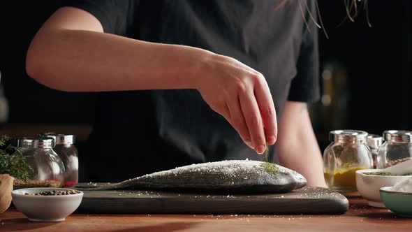 Woman Cooking Fish Closeup