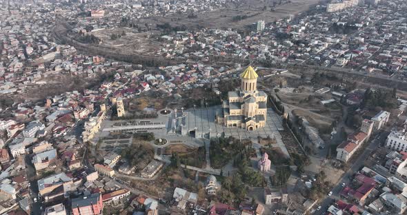 Aerial view of Holy Trinity Cathedral Sameba in Tbilisi Georgia. Sunrise drone footage.