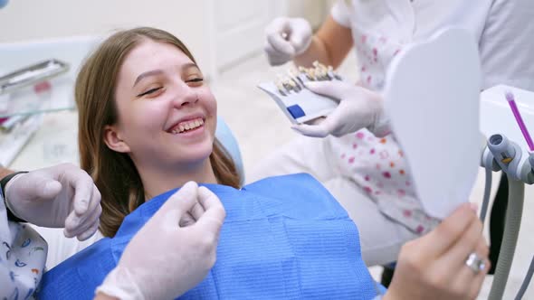 Smiling female patient at dentist's