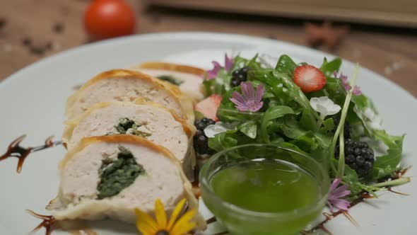 Chicken Roll with Spinach Nicely Served on a Plate