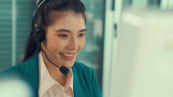 Business People Wearing Headset Working Actively in Office