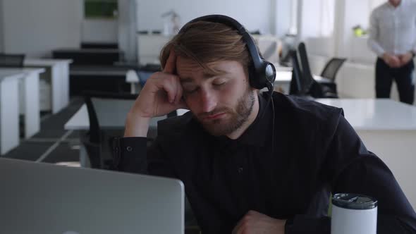 Monday Motivation of Young Worker with Headphones