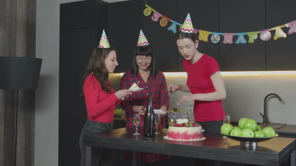 Joyful Woman Putting Pieces of Cake on Plates