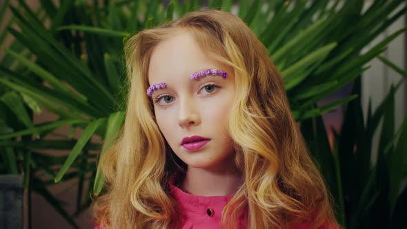 Portrait of Fashionable Young Girl Looking at Camera