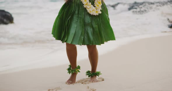 Woman performing Hawaiian hula on the beach