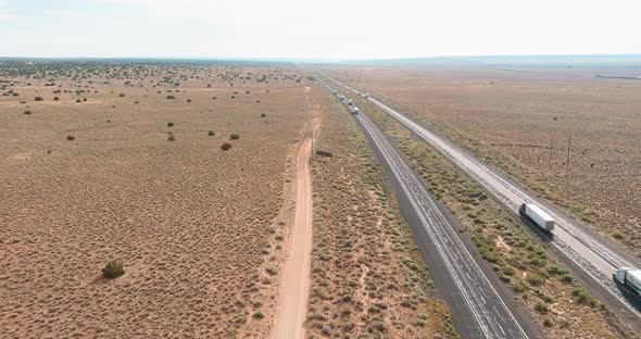 Aerial View of Long Road Through Desert Landscape Towards Near San Jon New Mexico USA