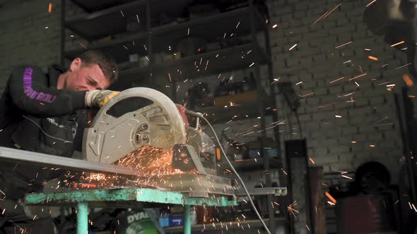 Footage of a Man Work with Grinding a Sheet of Metal / Videohive