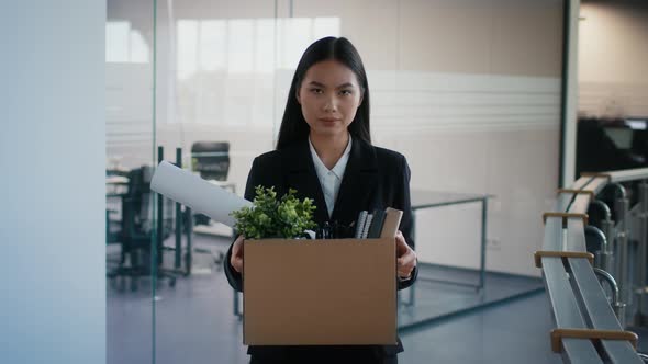Fired Asian Lady Carrying Box Leaving Workplace After Dismissal Indoor