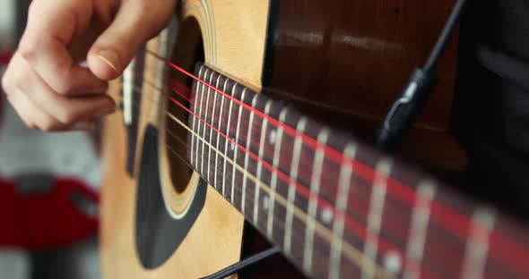 Strumming a Guitar Close Up in Super Slow Motion 300Fps