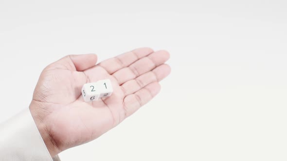 Hand Holds Numbered Dice Two And One Twenty One