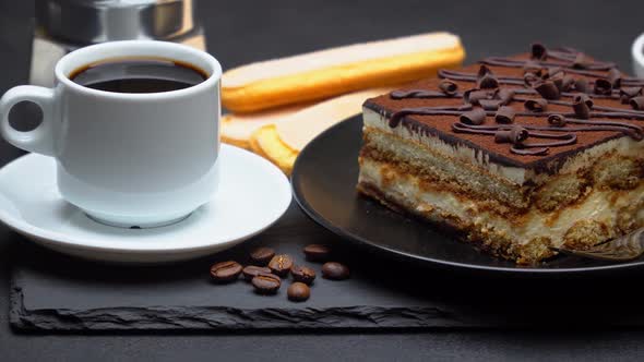 Portion of Traditional Italian Tiramisu Dessert Cup of Espresso Mocha and Coffee Beans