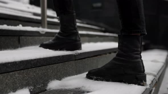 Woman is Walking Over Outdoor Stair on Street at Winter Stepping on Snow Closeup of Feet