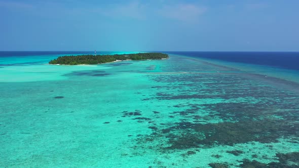 Aerial view seascape of tranquil coastline beach break by clear ocean with white sandy background of