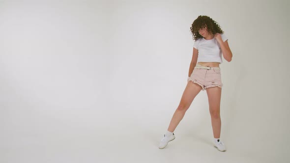 Girl in Shorts Dancing in the Studio