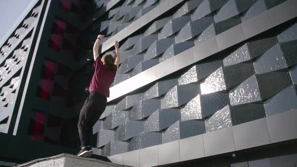 Young Female Gymnast Doing a Backflip Girl Doing a Somersault  Slow Motion Cityscape