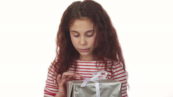 A Cunning Girl Unpacks Her New Year Gift