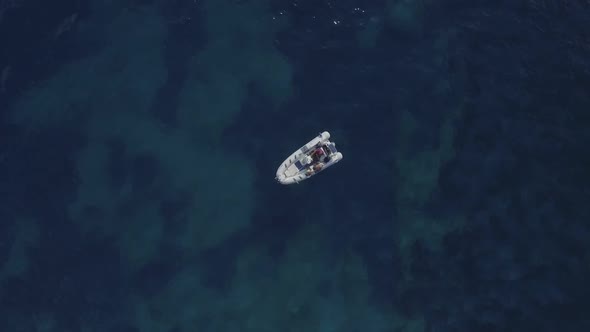 Speed boat static on dark blue sea background