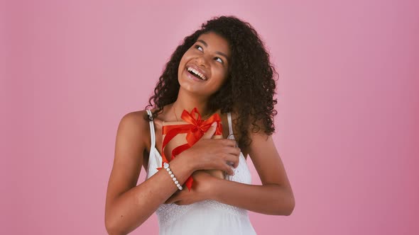 Ethnic Black Lady in Jewelry and White Dress