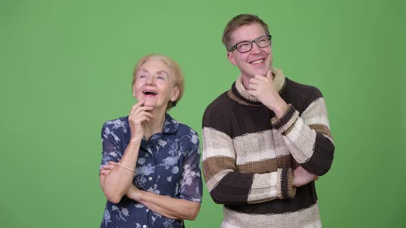 Happy Grandmother and Grandson Thinking Together