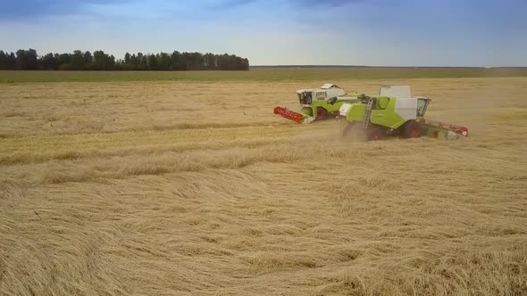 Aerial Motion To Harvester Operating in Wheat Field