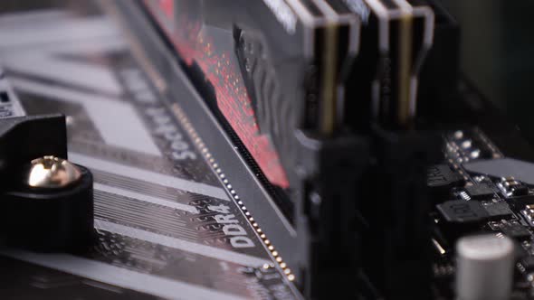 A random-access memory (RAM) installs in the socket on motherboard. PC hardware