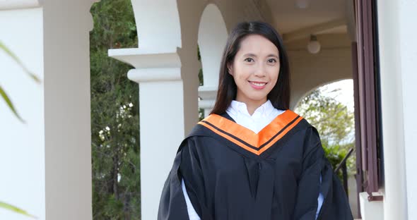 Asian woman get graduation in university campus