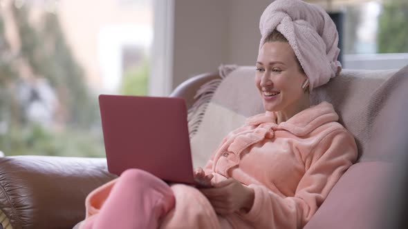 Portrait of Relaxed Cheerful Caucasian Young Woman Waving at Laptop Video Chat Talking in Slow