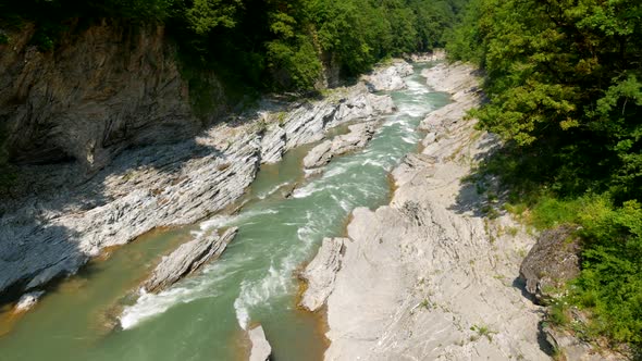 Panning shot of landscape with mountain river