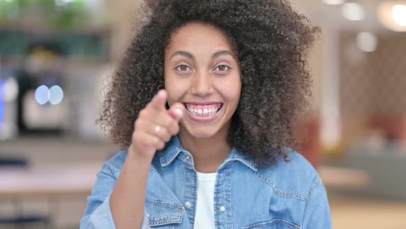 Young Latin Woman Showing Heart Sign with Hand