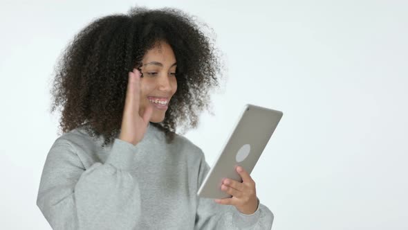 Video Chat on Tablet By African Woman, White Background 