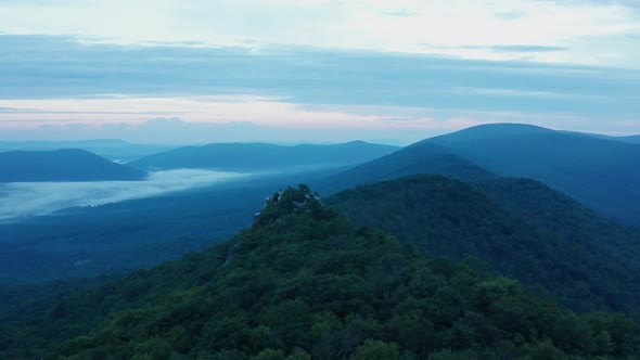 An aerial shot (dolly in) of Big Schloss, Great North Mountain and the Trout Run Valley at dawn in t