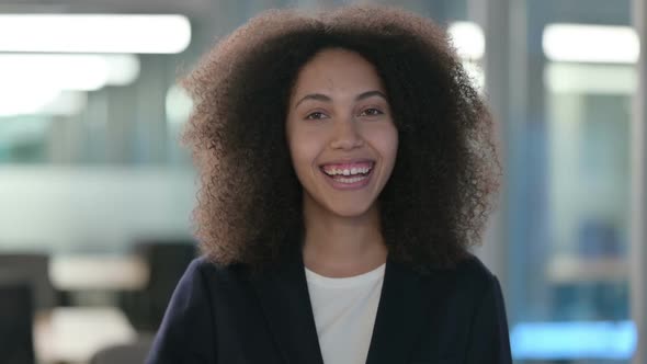 Portrait of Beautiful African Businesswoman Waving Welcoming