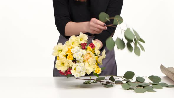 Florist Makes a Bouquet for Celebration. White. Close Up