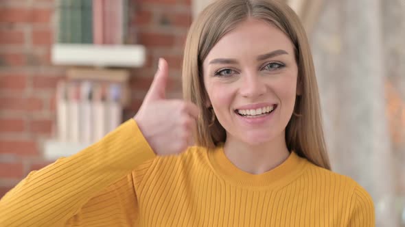 Portrait of Successful Young Woman Doing Thumbs Up