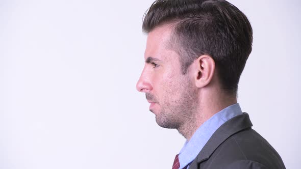 Profile View of Young Handsome Hispanic Businessman