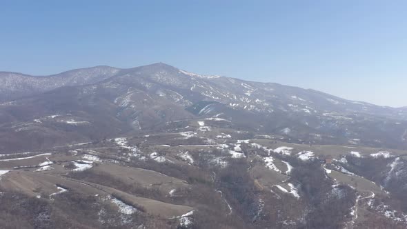 Top of the Deli Jovan mountain under snow 4K aerial video