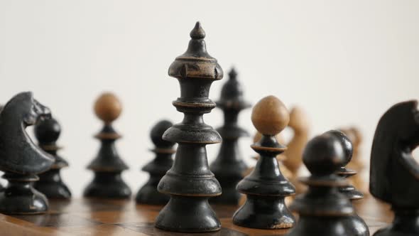 Black player wooden king  on chequered field 4K 2160p 30fps UltraHD  footage - Close-up of chess set alt