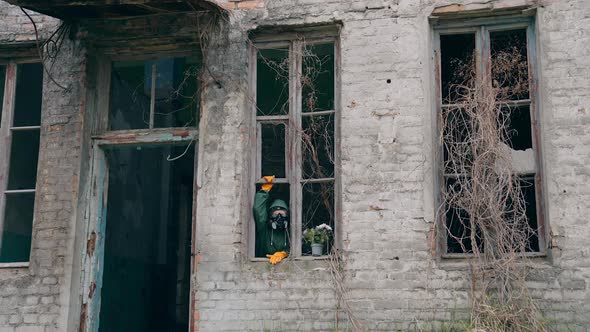 Man wearing protective suit and mask against radioactive environment