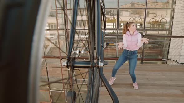 Young Woman Dancing on Roof Terrace