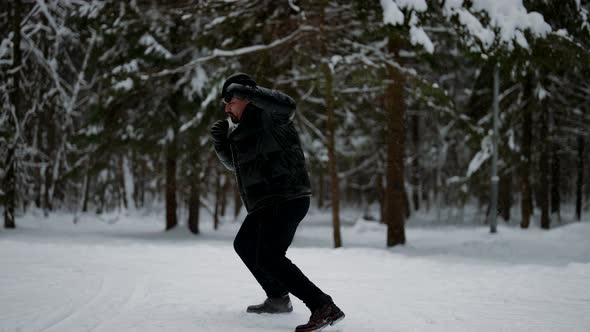 Shadow Fight A Professional Mixed Martial Arts Athlete Trains Outdoors in Winter