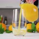 Orange Juice Pouring Into Glass on White Table - VideoHive Item for Sale