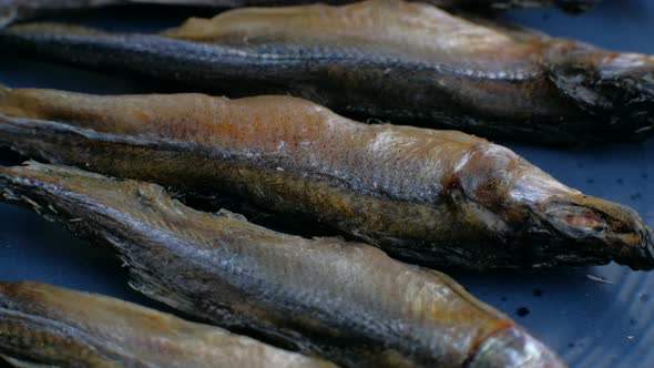 Salted Dried Fishes Rotation on Plate.