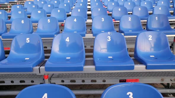 Grandstand seats - numbered temporary retractable seating. Modular stands with numbers