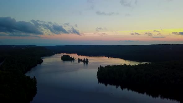 Aerial view of a picturesque, calm lake at sunset.